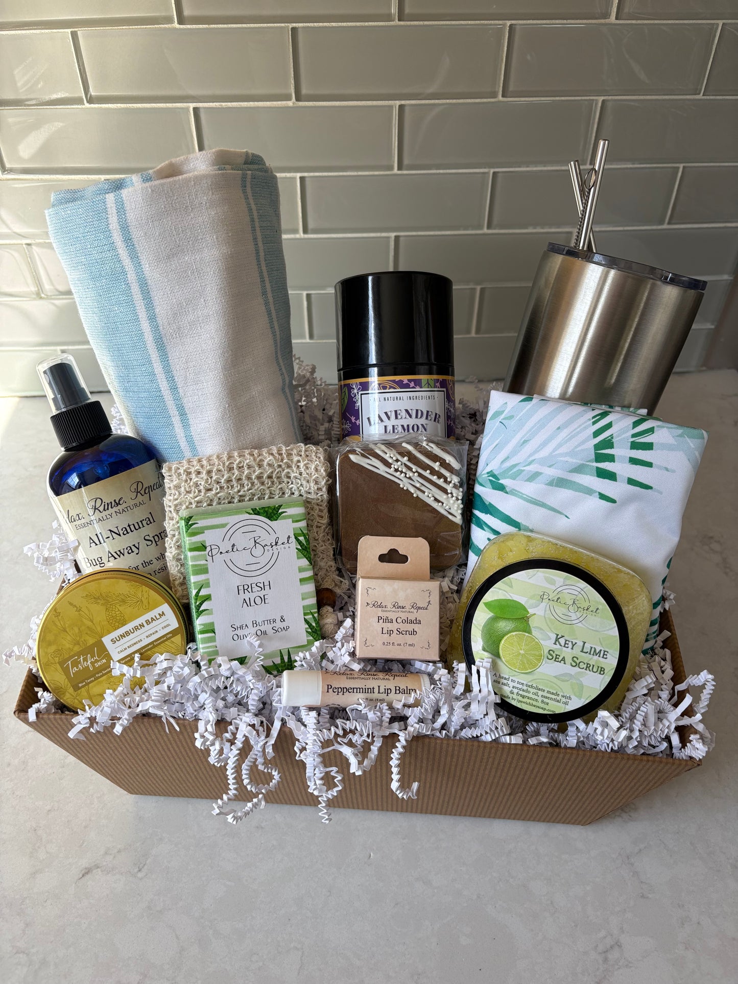 "Ultimate Summer Gift Basket with after sun balm, lip scrub, bug spray, aloe soap, sea scrub, s'mores bar, Turkish towel, margarita mix, and stainless steel tumbler"