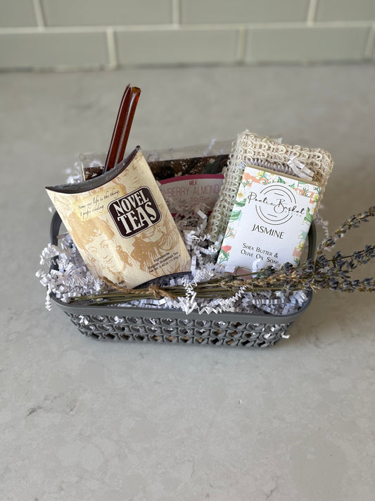 Little Love Basket with tea pouch, honey sticks, chocolate bar, jasmine soap bar, and soap saver bag"